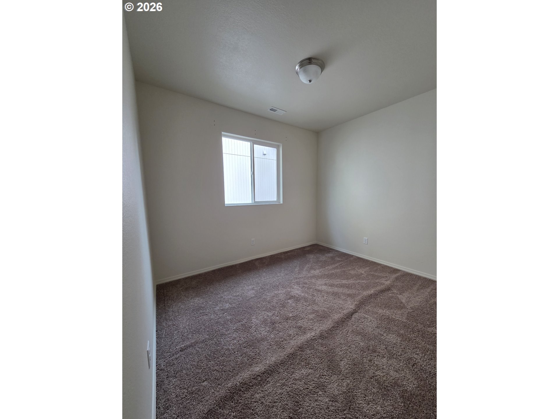 376 Bentgrass Court Sutherlin, OR 97479 - Photo 12 of 17 a view of a room that has a window in it