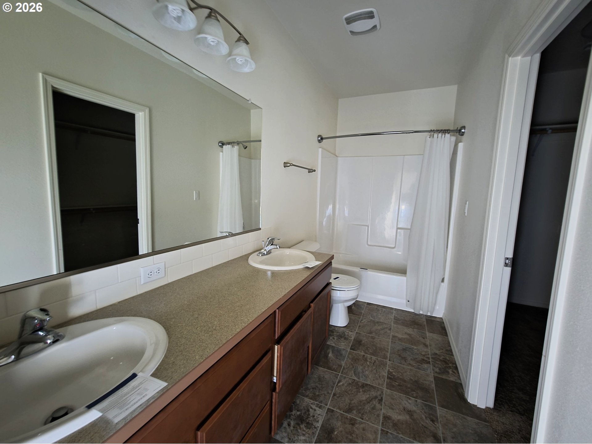 376 Bentgrass Court Sutherlin, OR 97479 - Photo 16 of 17 a bathroom with a granite countertop sink a mirror and a shower