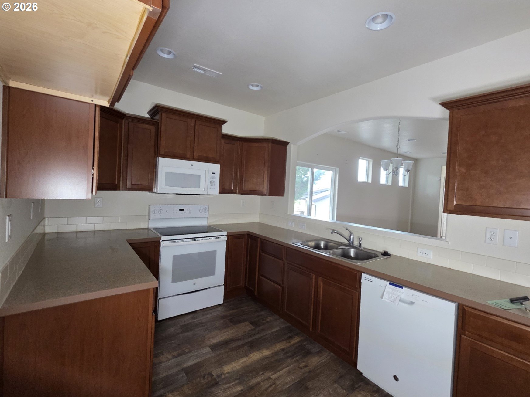 376 Bentgrass Court Sutherlin, OR 97479 - Photo 7 of 17 a kitchen with a sink stove and cabinets