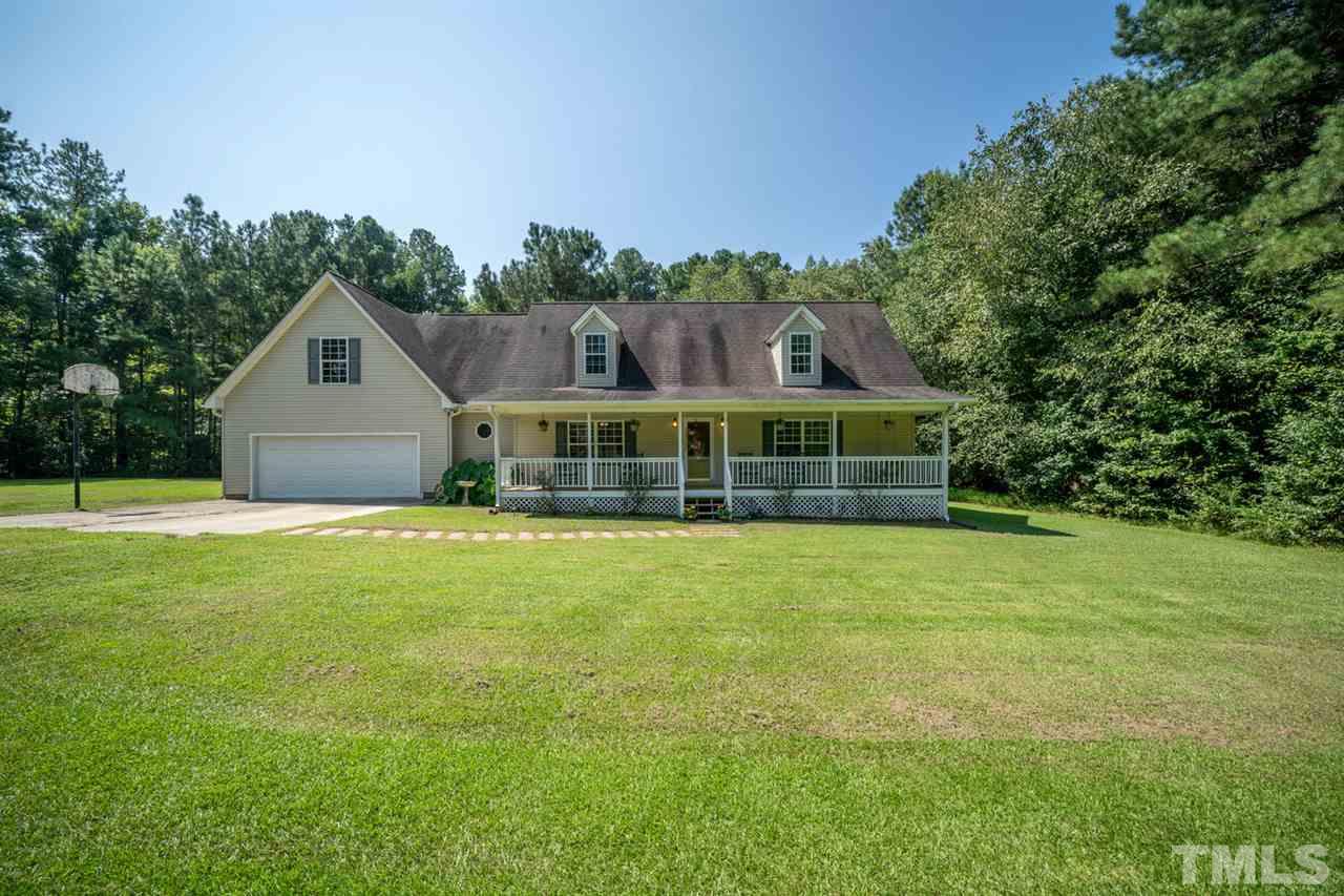 190 Landmark Road Willow Spring, NC 27592 - Photo 1 of 25 a front view of a house with a garden
