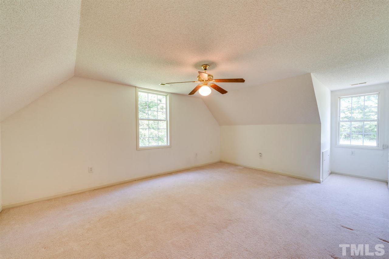 190 Landmark Road Willow Spring, NC 27592 - Photo 15 of 25 an empty room with windows and fan