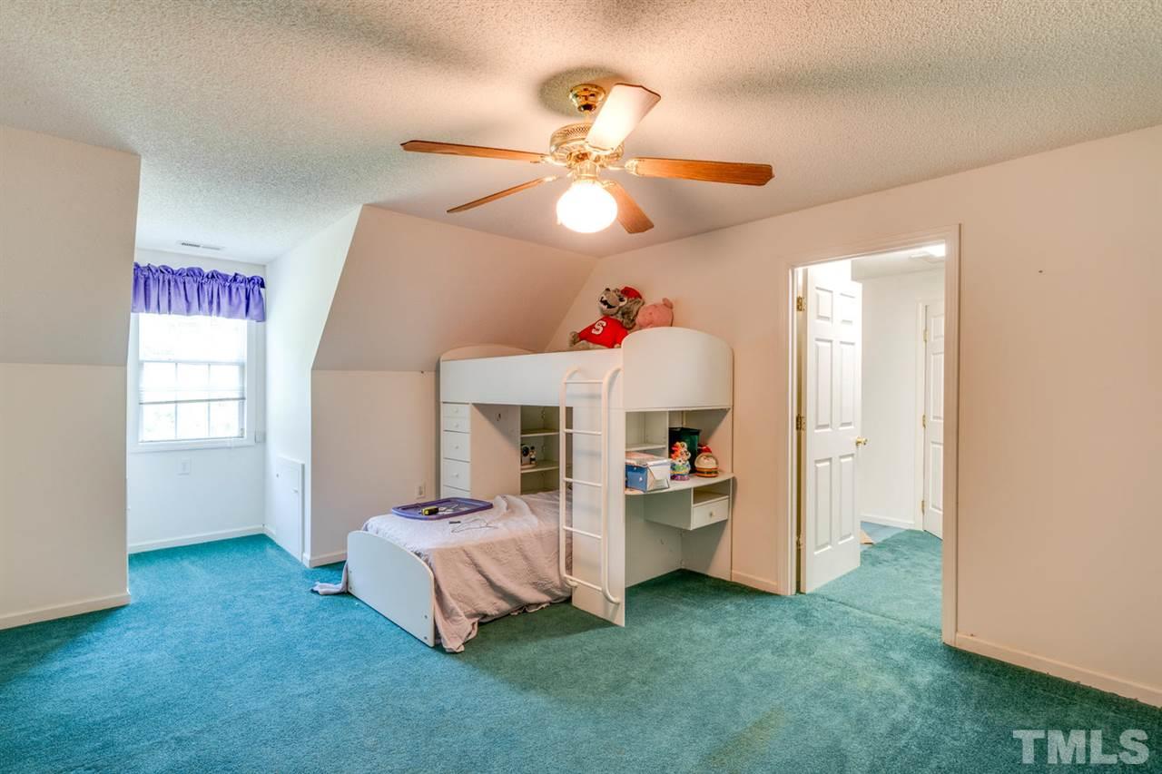 190 Landmark Road Willow Spring, NC 27592 - Photo 16 of 25 a very nice looking room with a dining table chairs and a chandelier