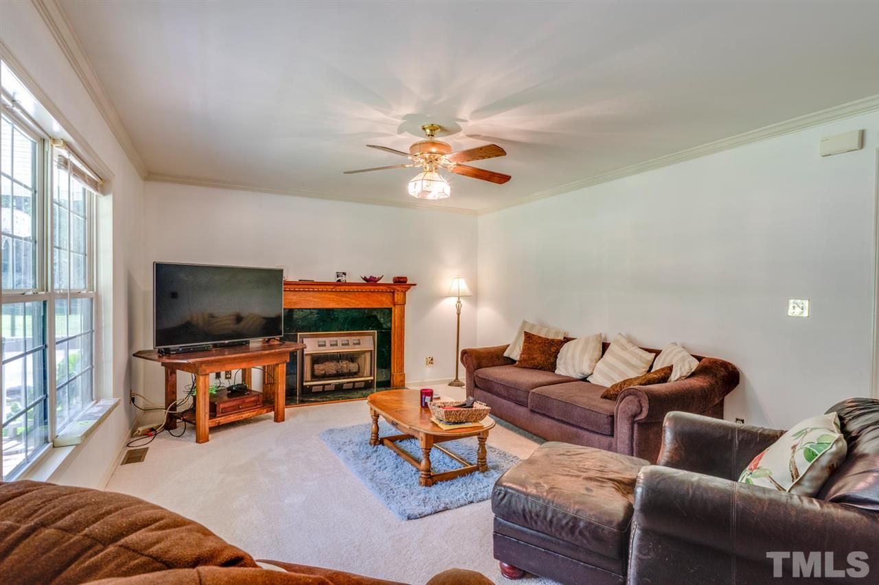 190 Landmark Road Willow Spring, NC 27592 - Photo 3 of 25 a living room with furniture and a flat screen tv