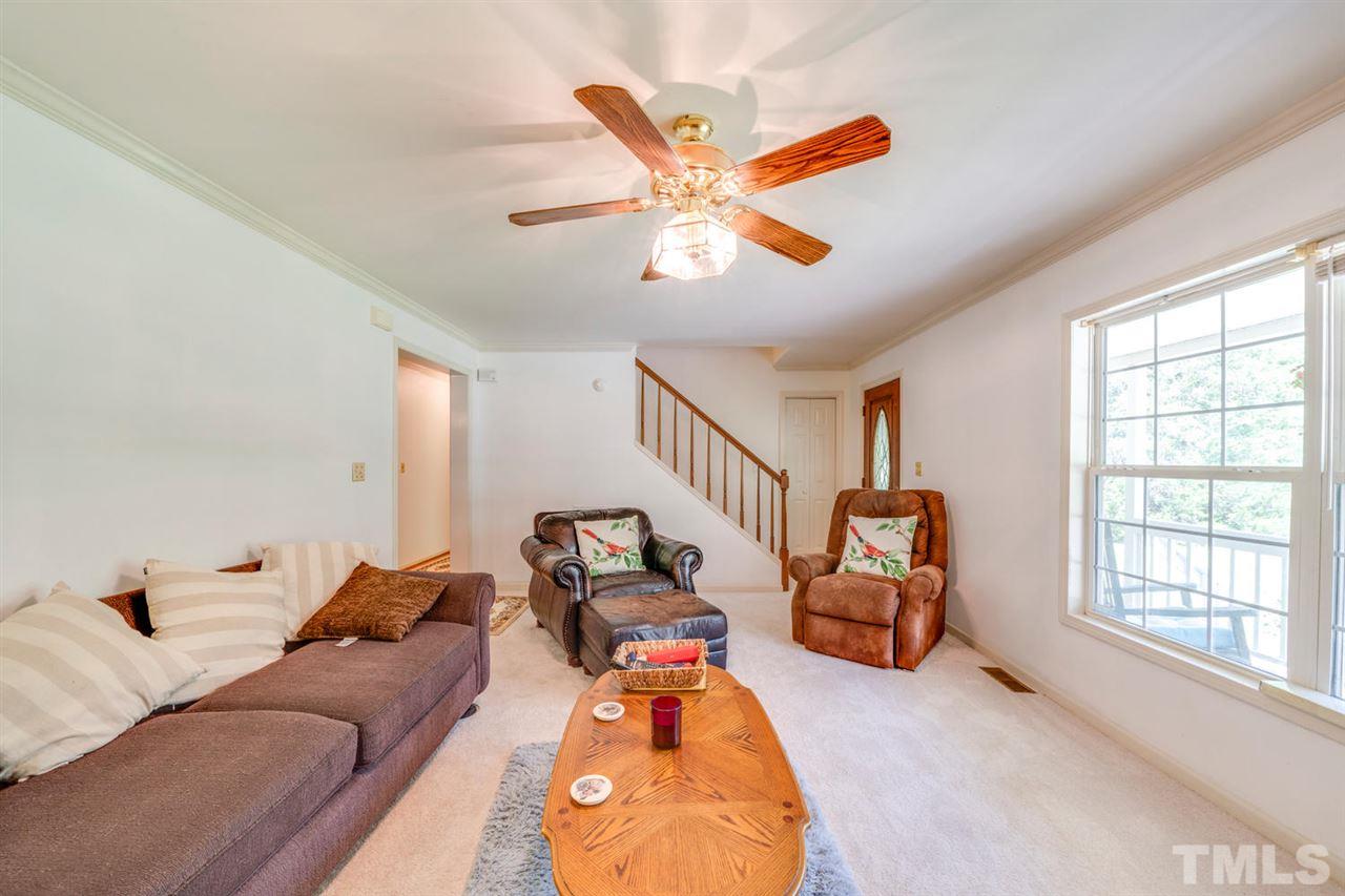 190 Landmark Road Willow Spring, NC 27592 - Photo 5 of 25 a living room with furniture and a large window