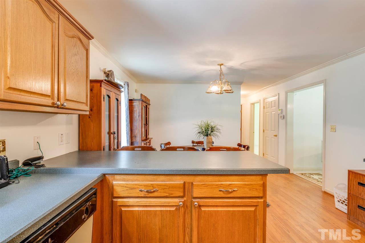 190 Landmark Road Willow Spring, NC 27592 - Photo 9 of 25 a view of a kitchen with a sink and cabinets