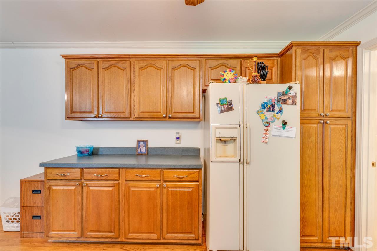 190 Landmark Road Willow Spring, NC 27592 - Photo 10 of 25 a white refrigerator freezer sitting in a kitchen