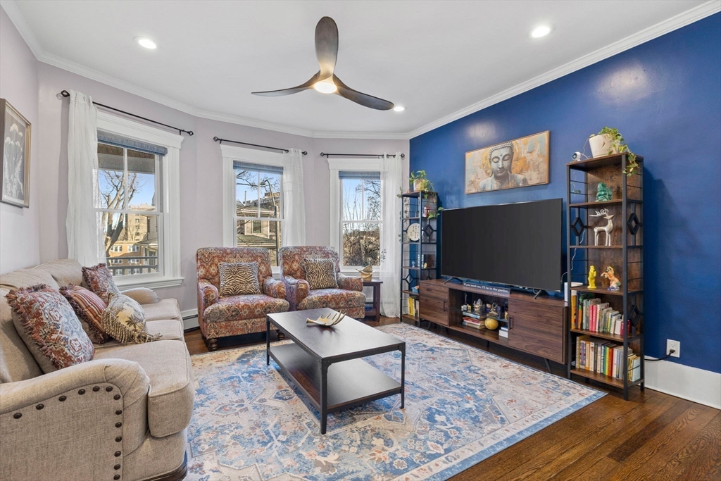 62 Atherton Road, Unit 1 Brookline, MA 02446 - Photo 6 of 24 a living room with furniture and a flat screen tv