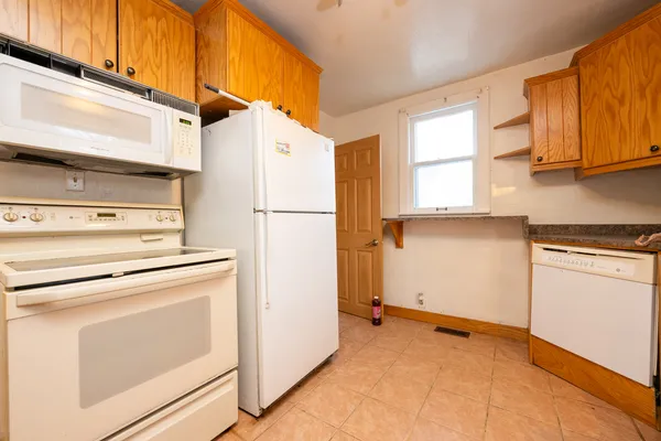 a view of a kitchen with washer and dryer