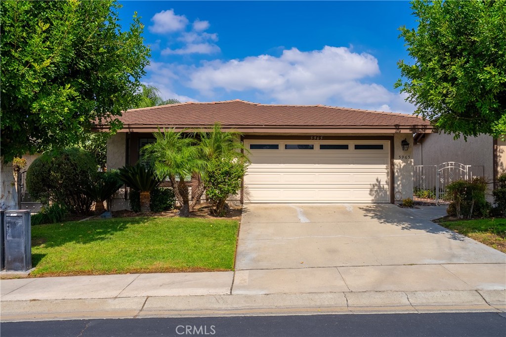 5965 Maybrook Circle Riverside, CA 92506 - Photo 1 of 25 a backyard of a house with plants and garden