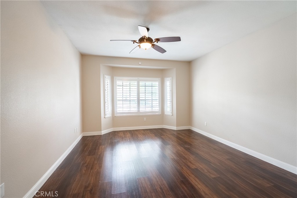 5965 Maybrook Circle Riverside, CA 92506 - Photo 16 of 25 wooden floor in an empty room with a window