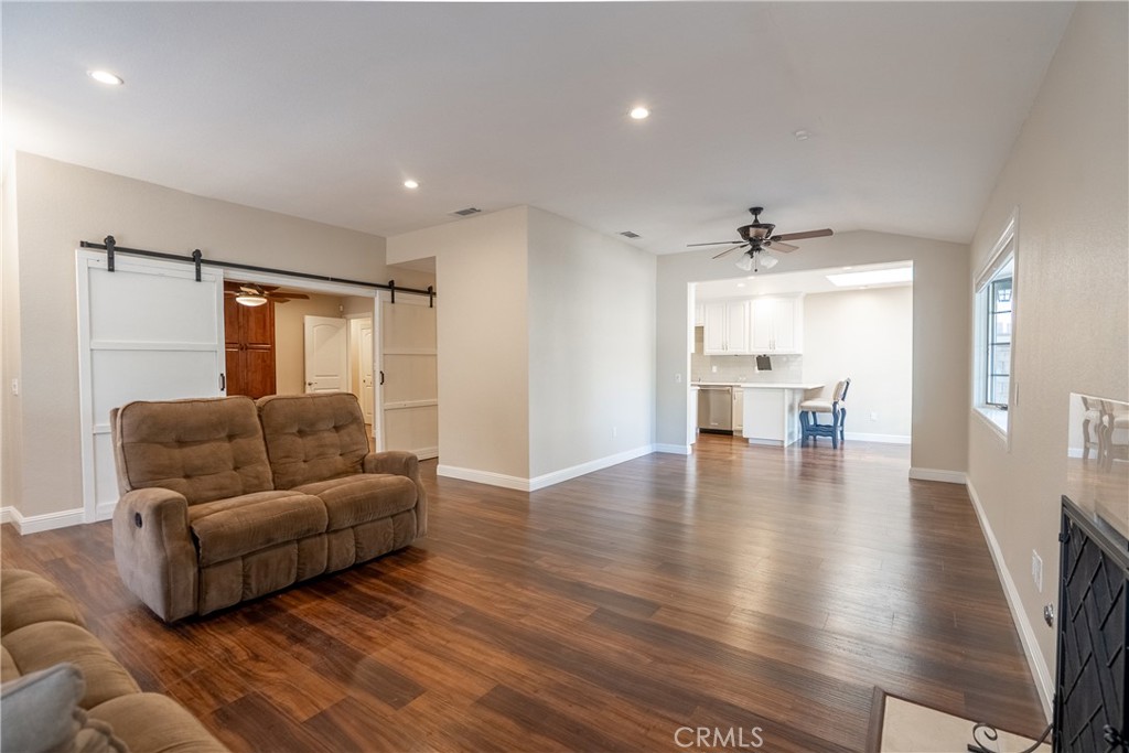 5965 Maybrook Circle Riverside, CA 92506 - Photo 6 of 25 a living room with furniture and wooden floor
