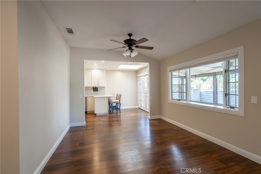5965 Maybrook Circle Riverside, CA 92506 - Photo 7 of 25 a view of a livingroom with a piano and wooden floor
