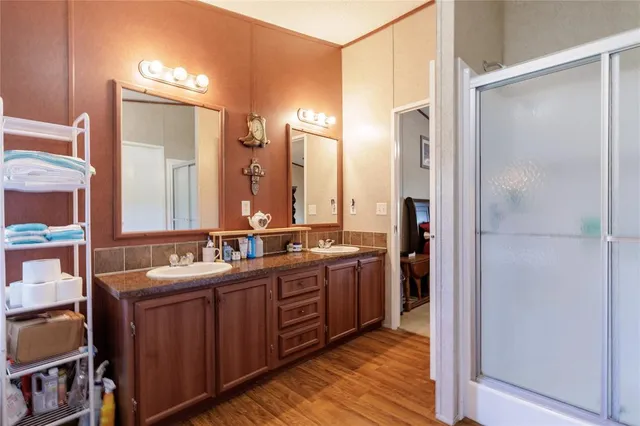 a bathroom with a double vanity sink mirror and double