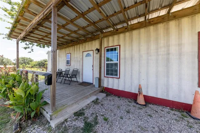a view of a house with backyard and garden