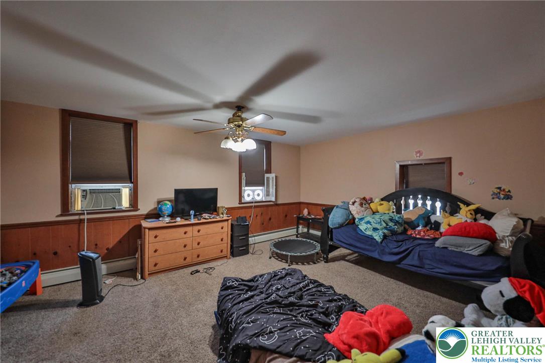 1770 Weilers Road Lower Macungie Township, PA 18011 - Photo 20 of 29 a living room with furniture fireplace and flat screen tv