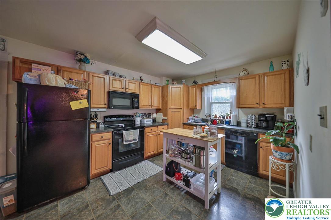 1770 Weilers Road Lower Macungie Township, PA 18011 - Photo 2 of 29 a kitchen with stainless steel appliances granite countertop a refrigerator stove and sink