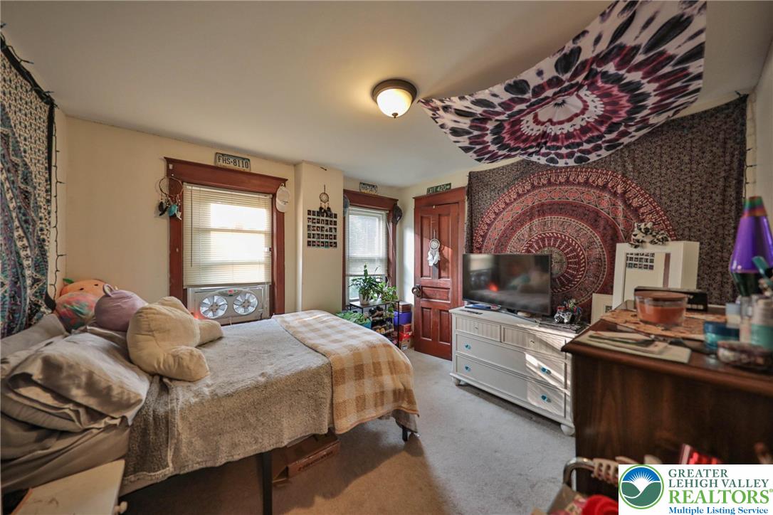 1770 Weilers Road Lower Macungie Township, PA 18011 - Photo 26 of 29 a bedroom with a bed and a television