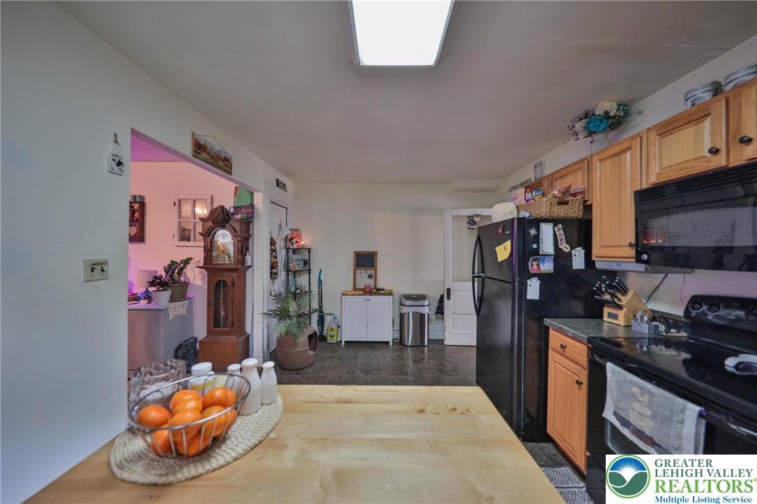 1770 Weilers Road Lower Macungie Township, PA 18011 - Photo 28 of 29 a kitchen that has a lot of cabinets a sink and a stove in it