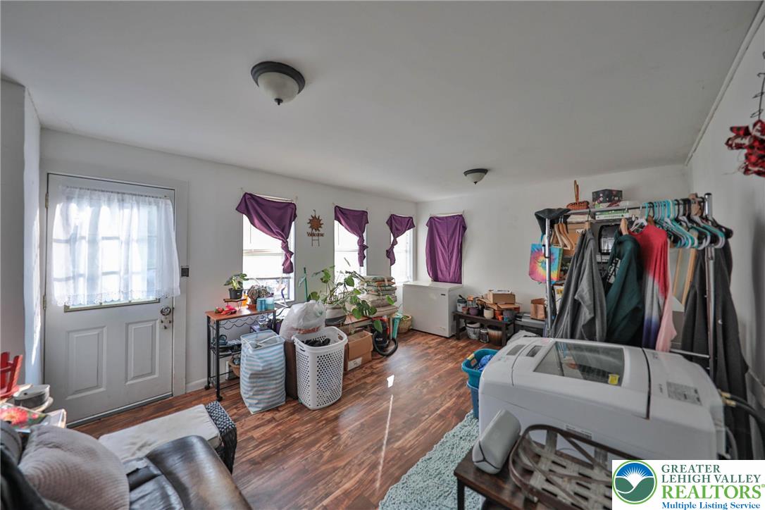 1770 Weilers Road Lower Macungie Township, PA 18011 - Photo 29 of 29 a living room with furniture a flat screen tv and a window
