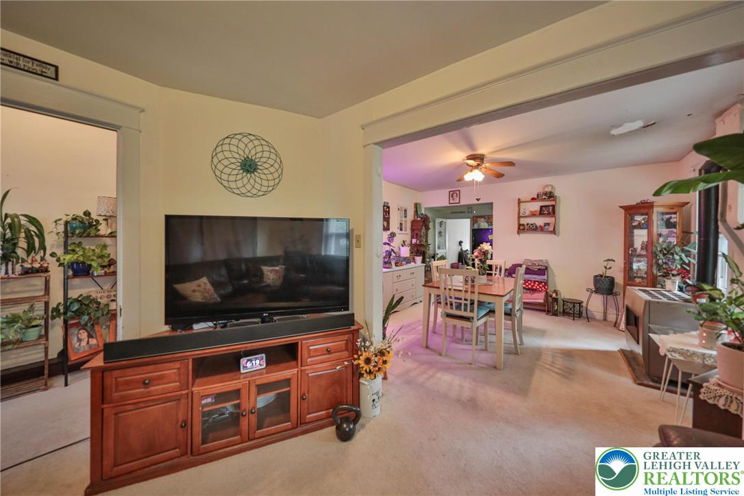 1770 Weilers Road Lower Macungie Township, PA 18011 - Photo 4 of 29 a living room with furniture and a flat screen tv