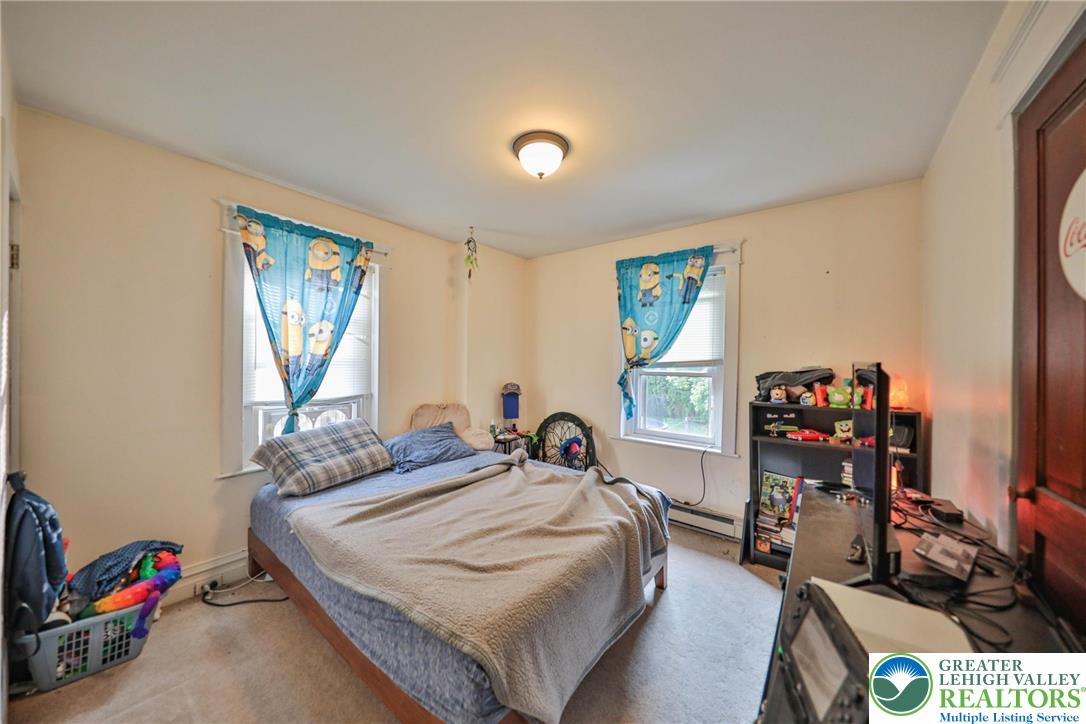 1770 Weilers Road Lower Macungie Township, PA 18011 - Photo 7 of 29 a bedroom with a bed and a large window