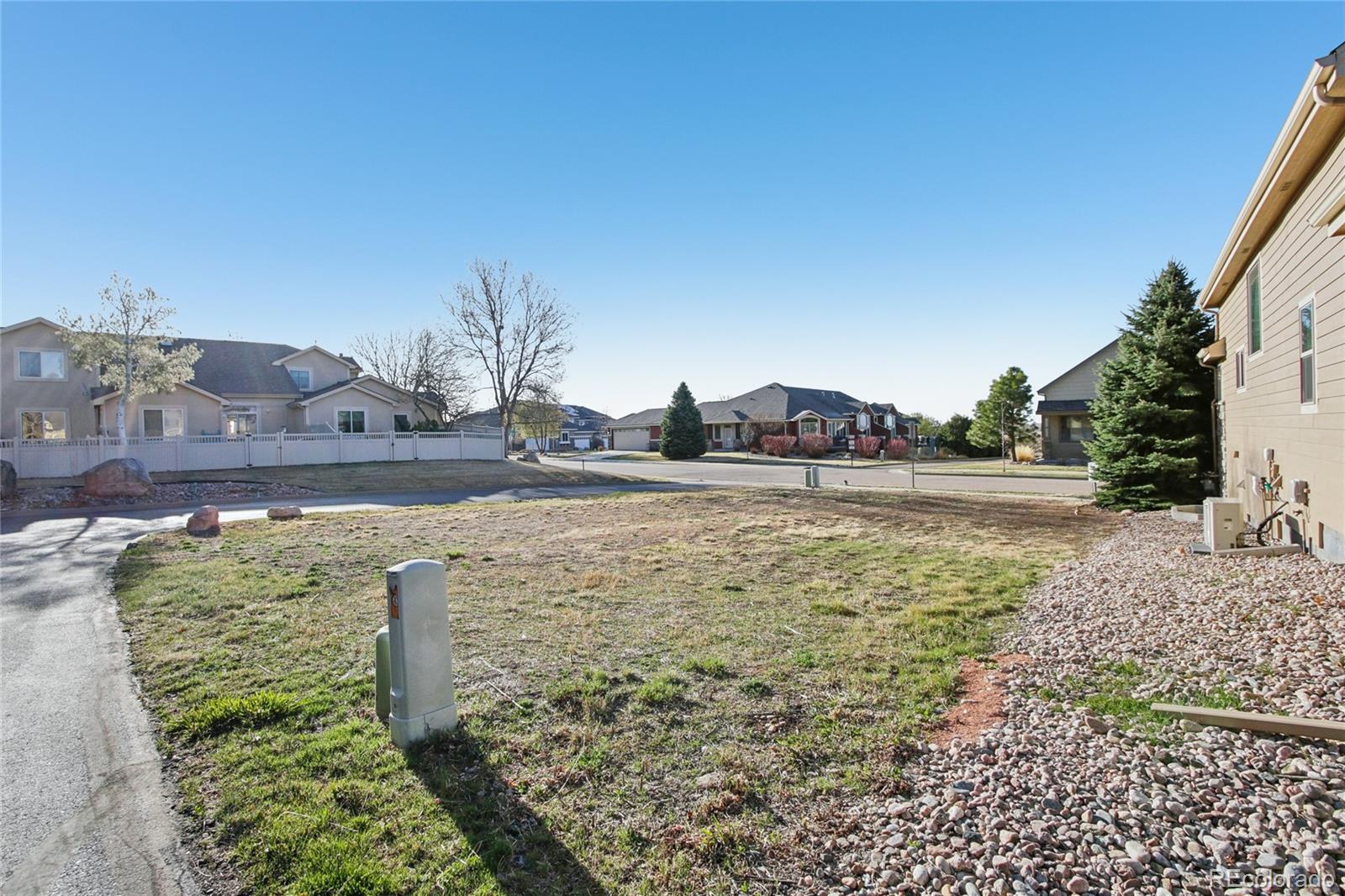 1802 Prairie Ridge Drive Fort Collins, CO 80526 - Photo 5 of 14 a view of a water fountain with an buildings in the background