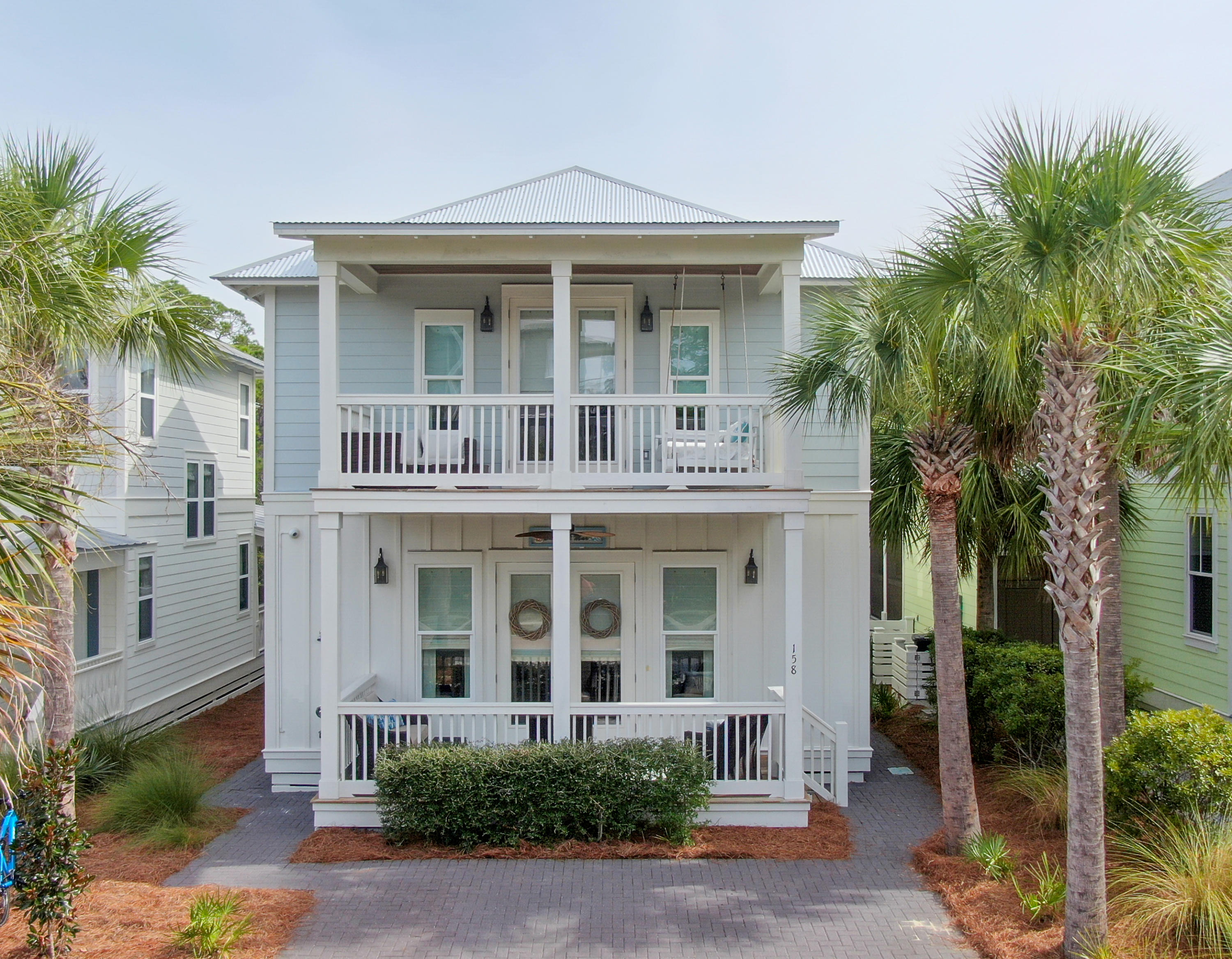 158 East Blue Crab Loop Inlet Beach, FL 32461 - Photo 1 of 43 front view of a brick house with a small yard