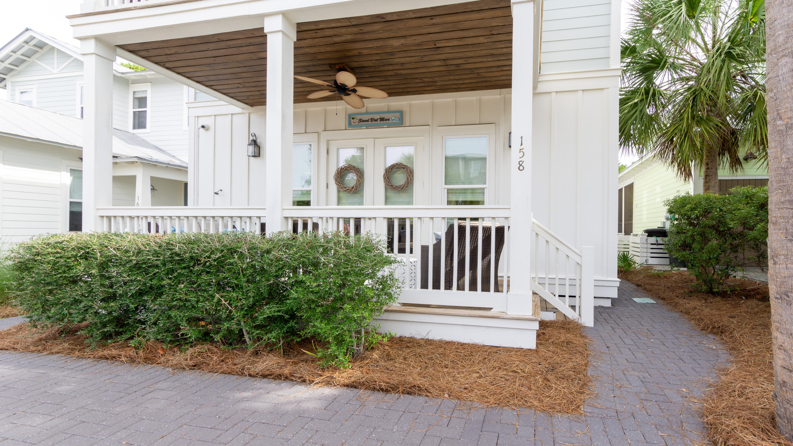 158 East Blue Crab Loop Inlet Beach, FL 32461 - Photo 2 of 43 a front view of a house with a garden