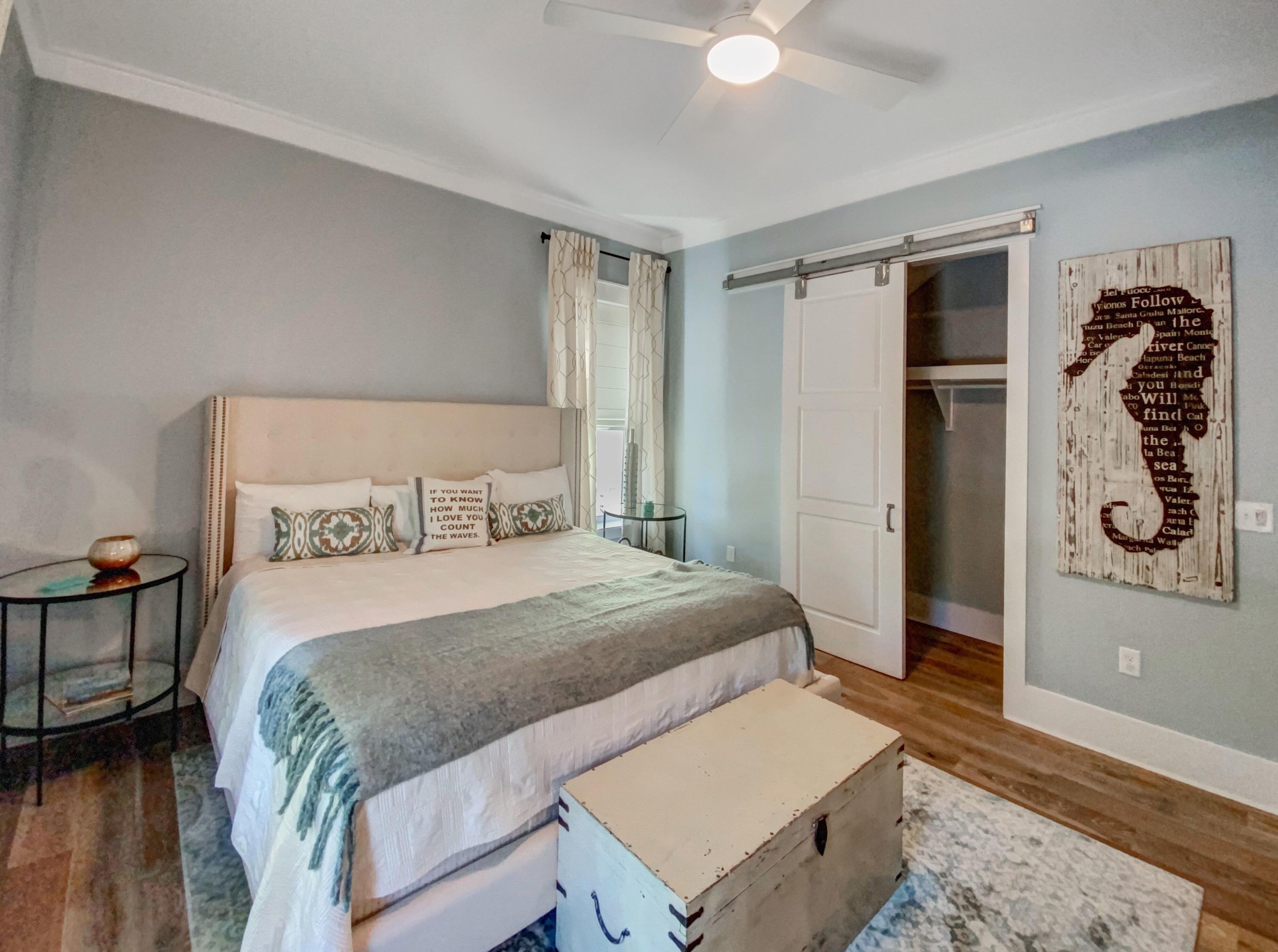 158 East Blue Crab Loop Inlet Beach, FL 32461 - Photo 12 of 43 a bedroom with a bed and a dresser