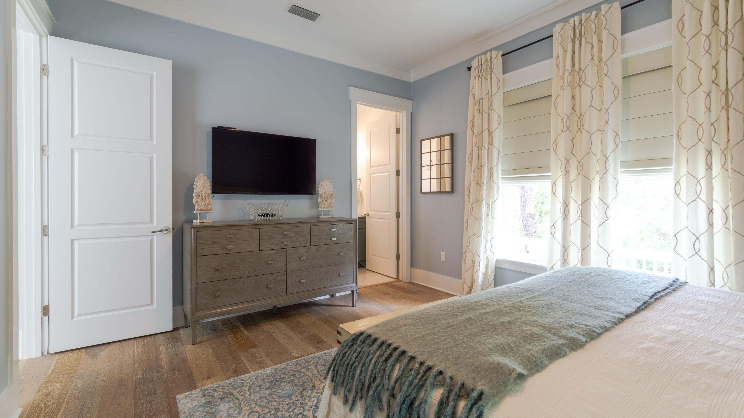 158 East Blue Crab Loop Inlet Beach, FL 32461 - Photo 14 of 43 a bedroom with a bed and flat screen tv