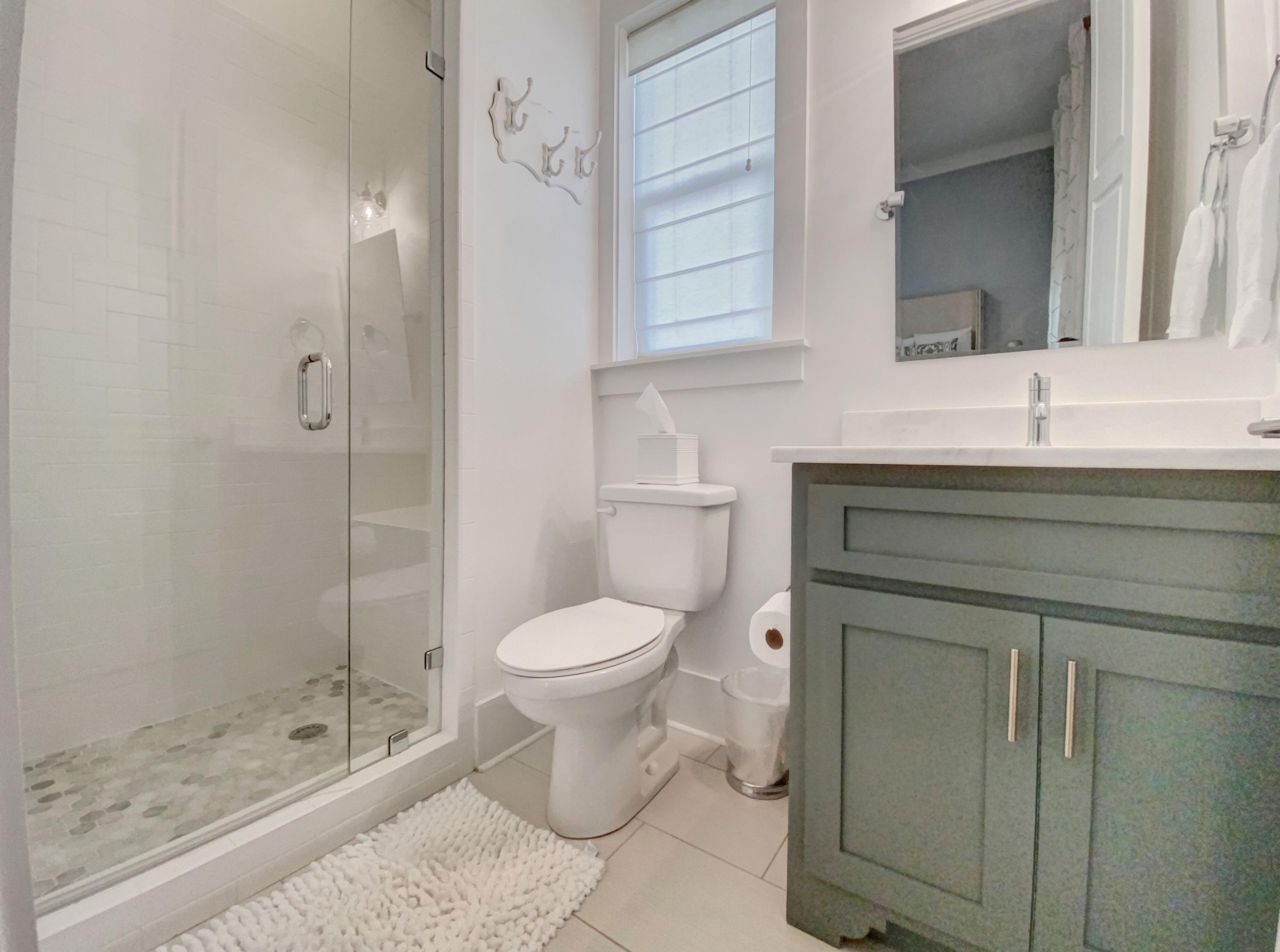 158 East Blue Crab Loop Inlet Beach, FL 32461 - Photo 15 of 43 a bathroom with a sink a toilet and shower