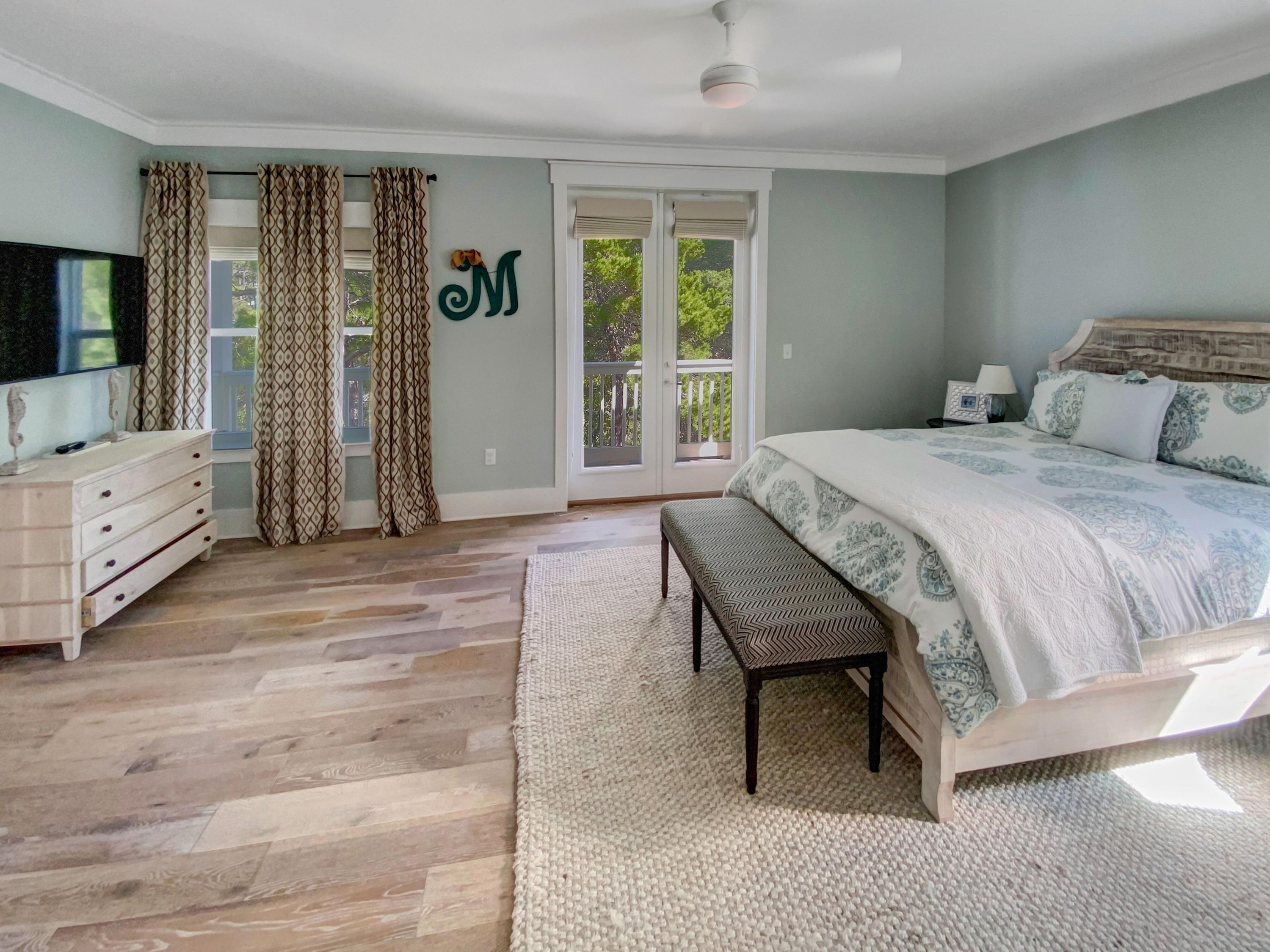 158 East Blue Crab Loop Inlet Beach, FL 32461 - Photo 19 of 43 a bedroom with a bed and a dresser