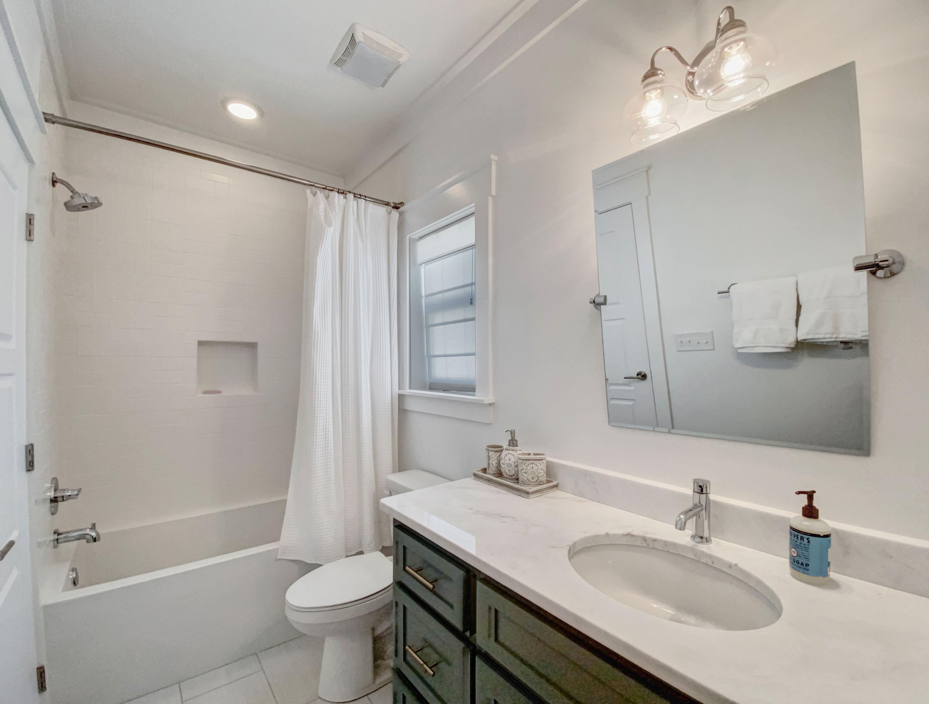 158 East Blue Crab Loop Inlet Beach, FL 32461 - Photo 21 of 43 a bathroom with a sink double vanity granite tub and a mirror