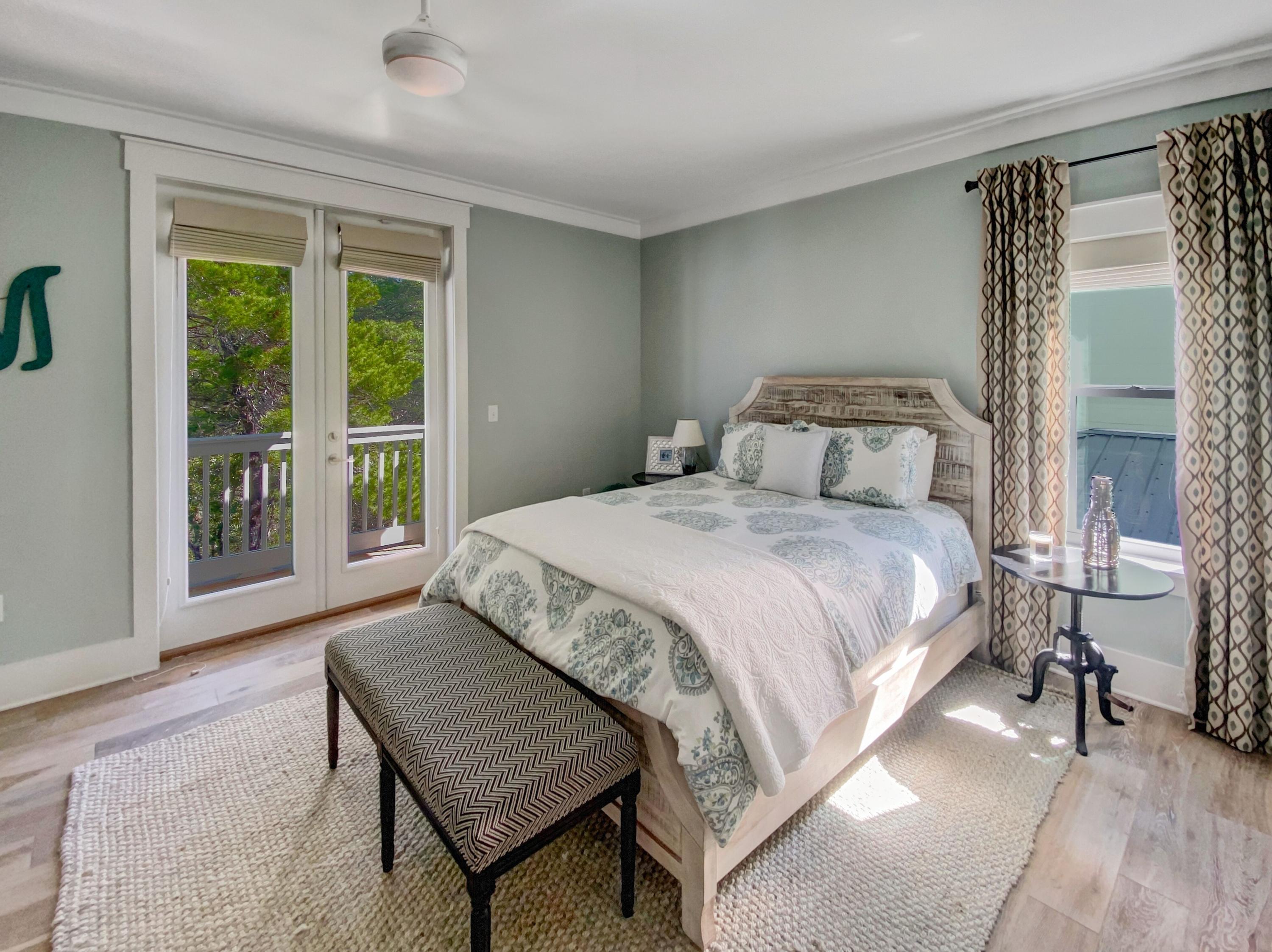 158 East Blue Crab Loop Inlet Beach, FL 32461 - Photo 22 of 43 a bedroom with a bed and a window