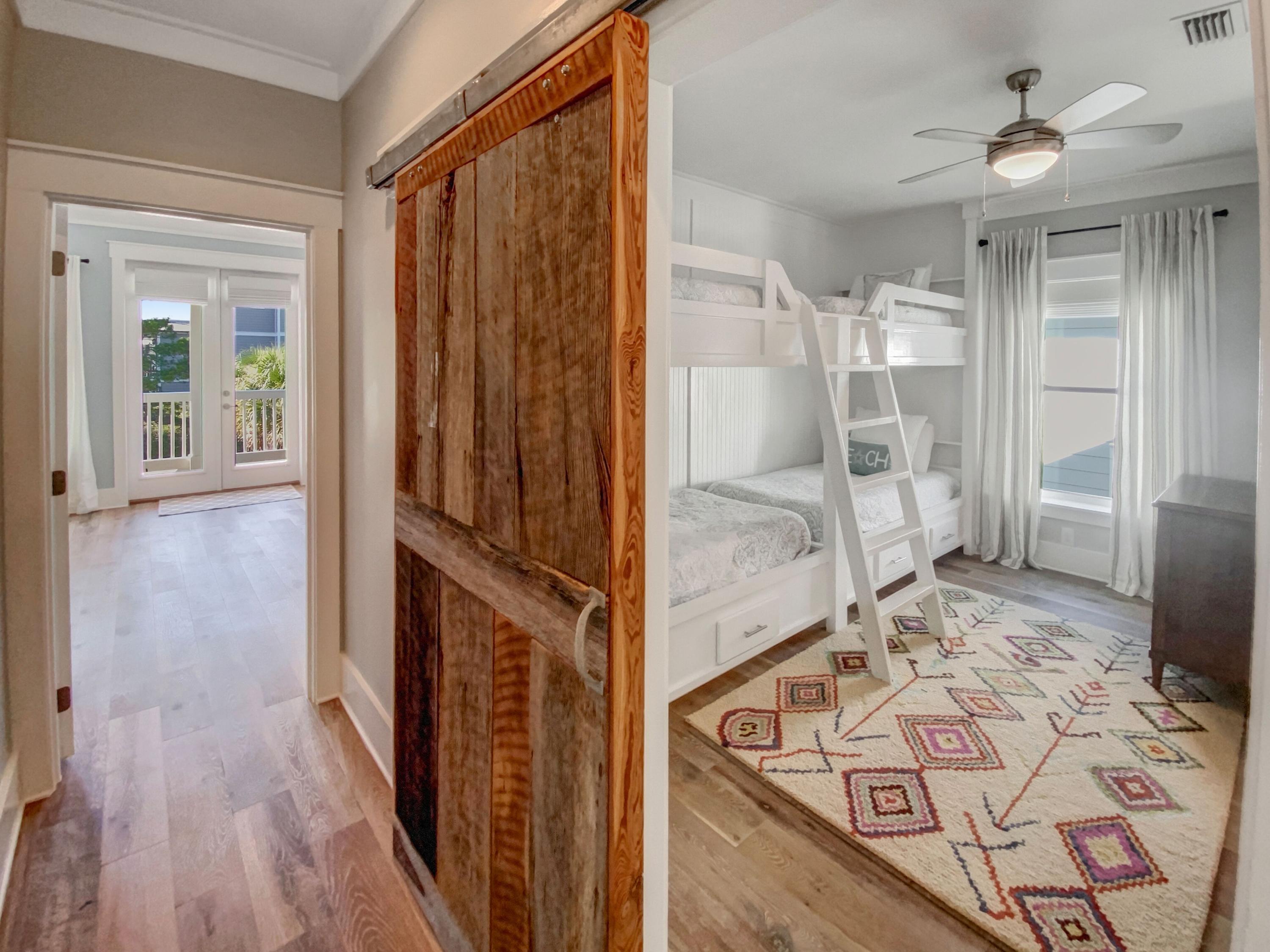 158 East Blue Crab Loop Inlet Beach, FL 32461 - Photo 23 of 43 a view of a hallway with wooden floor and a living room