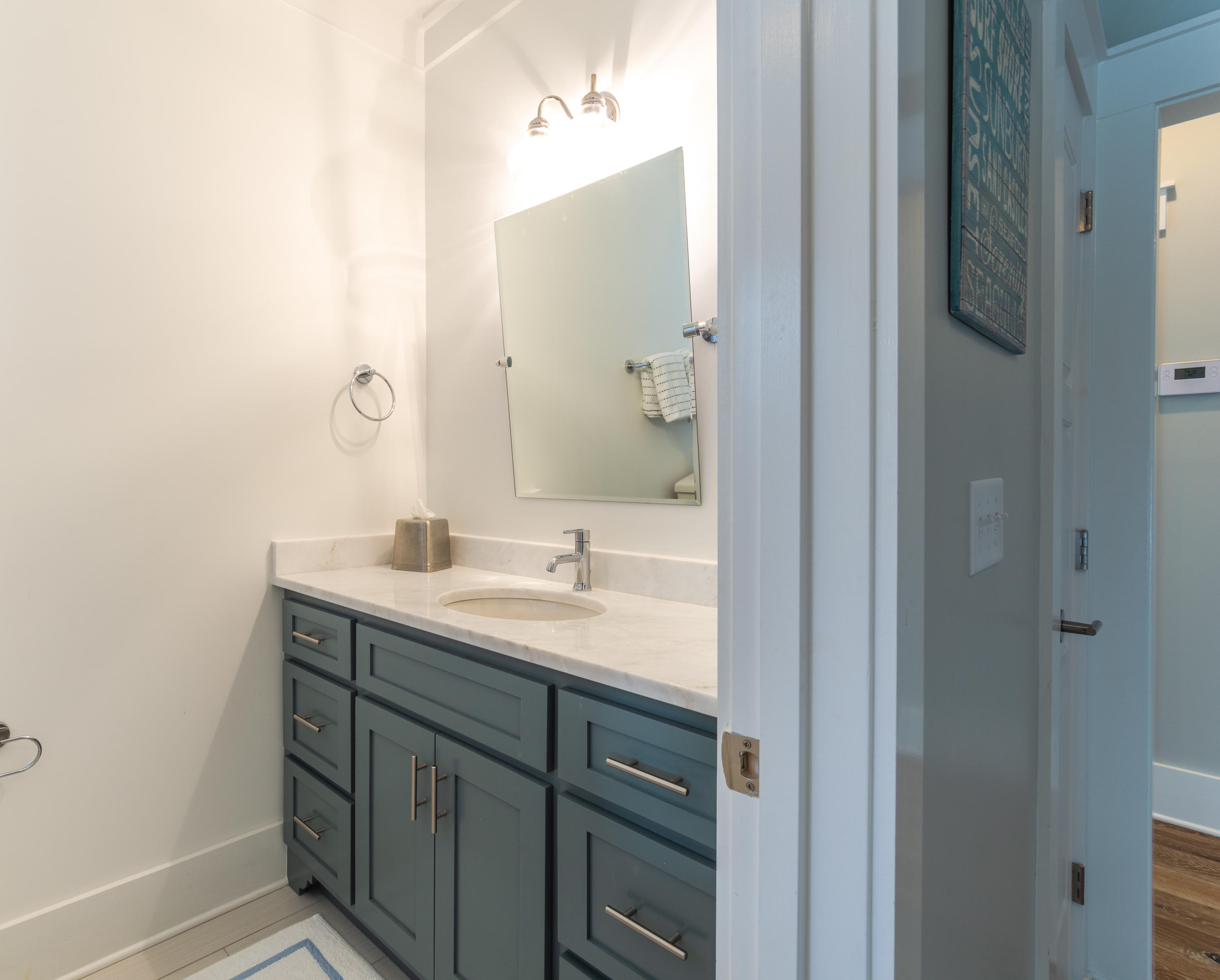 158 East Blue Crab Loop Inlet Beach, FL 32461 - Photo 27 of 43 a bathroom with a sink and a mirror