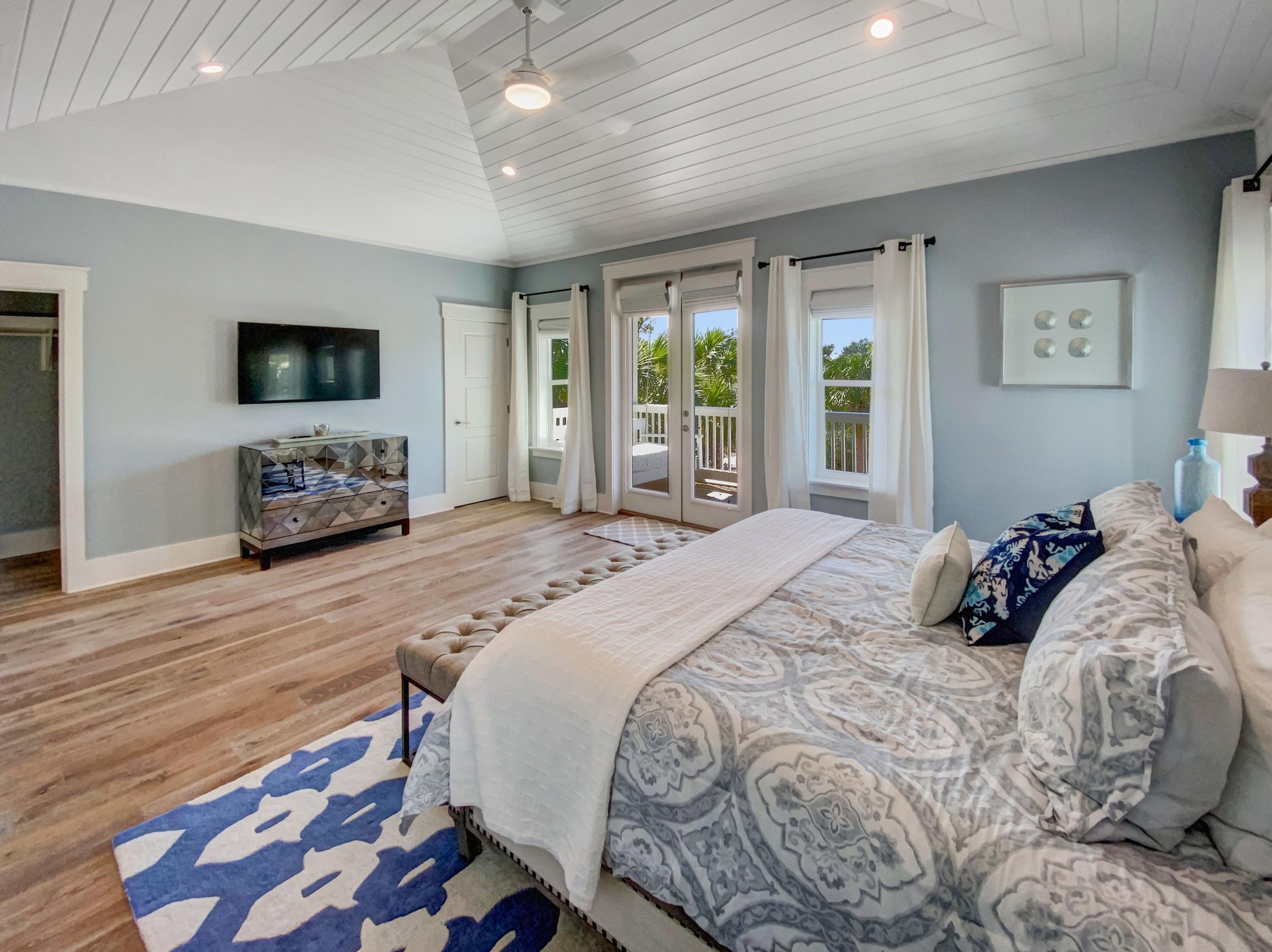 158 East Blue Crab Loop Inlet Beach, FL 32461 - Photo 29 of 43 a bedroom with a bed and a flat screen tv