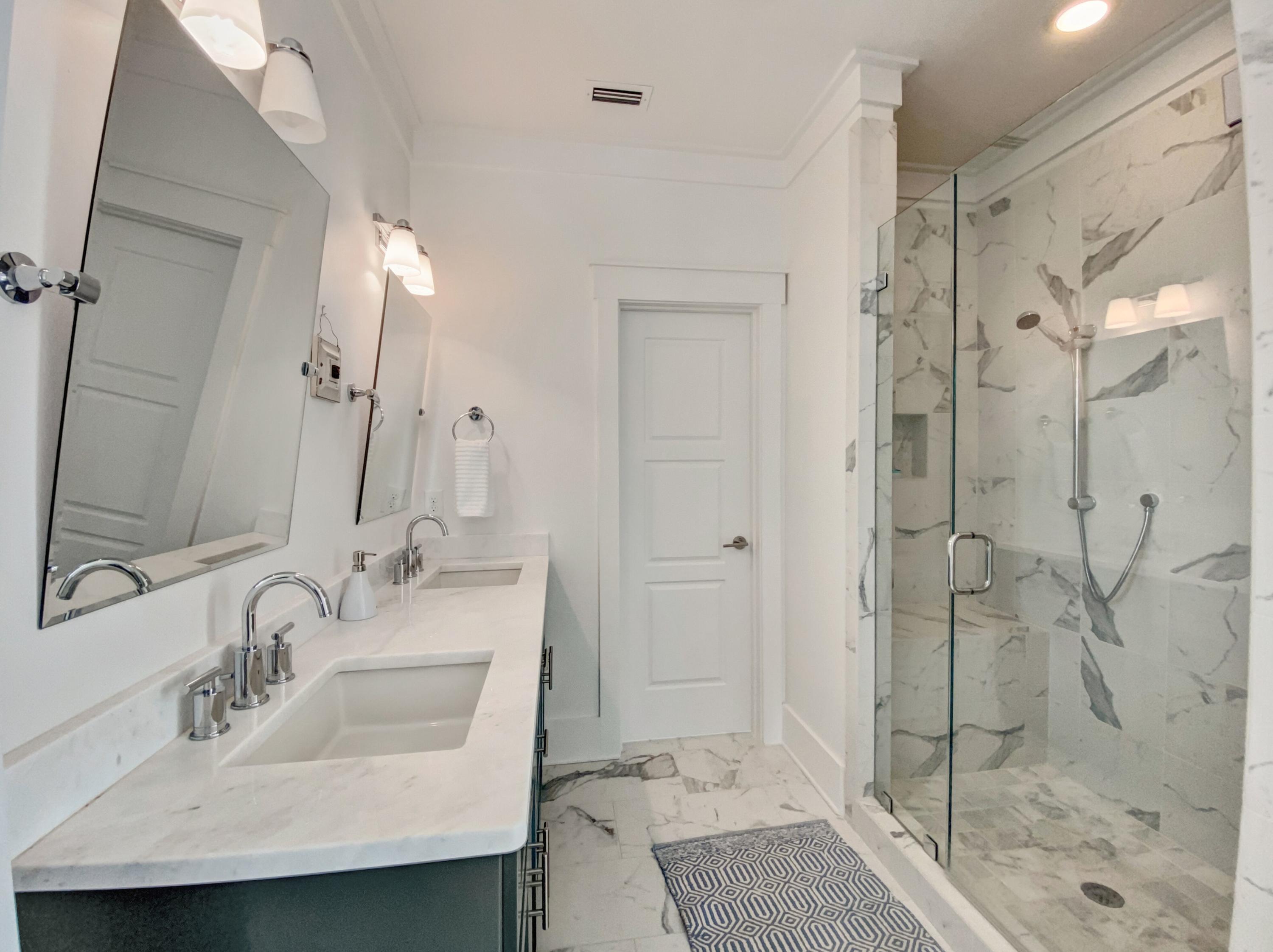 158 East Blue Crab Loop Inlet Beach, FL 32461 - Photo 30 of 43 a bathroom with a sink and a mirror