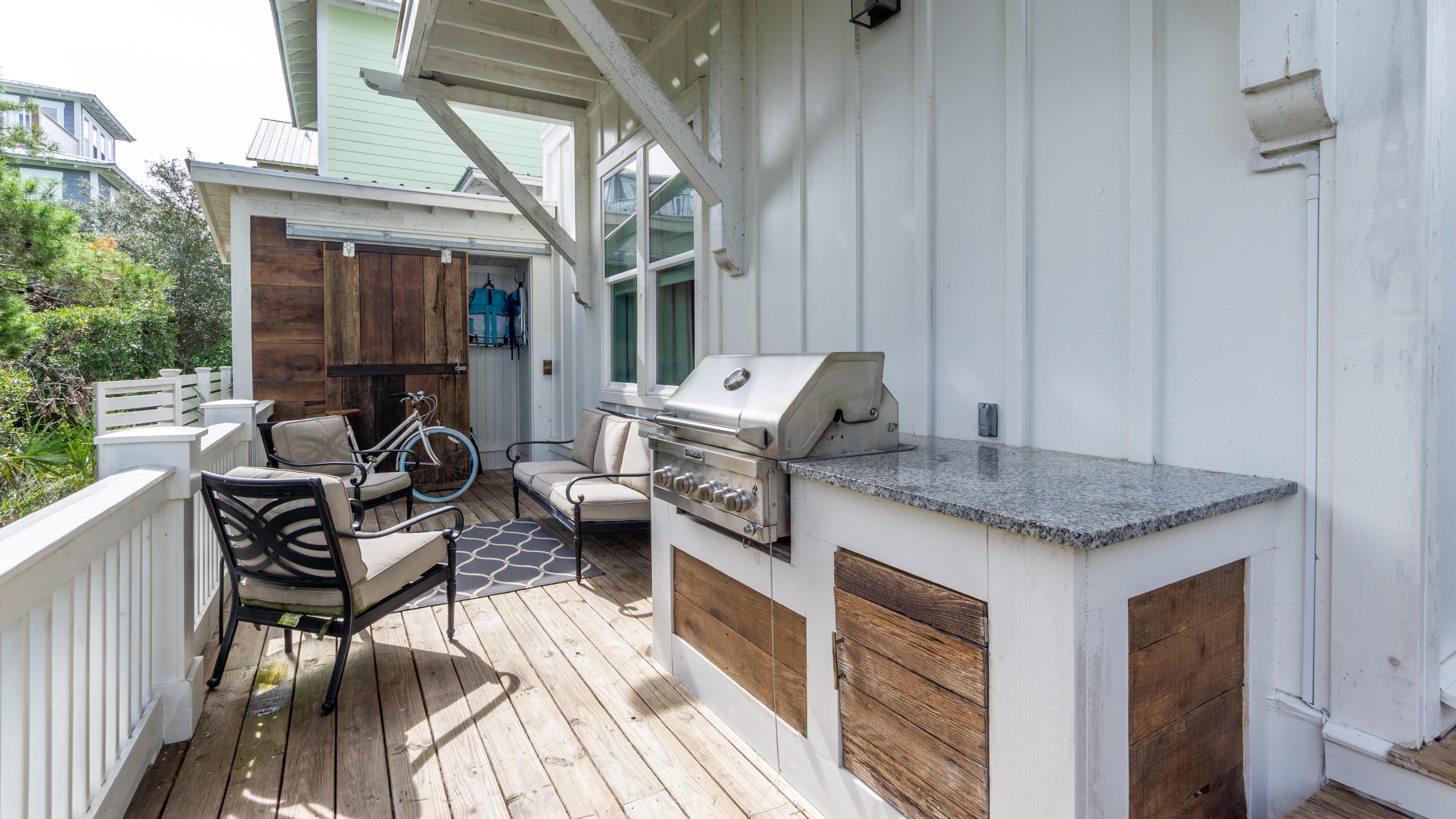 158 East Blue Crab Loop Inlet Beach, FL 32461 - Photo 36 of 43 a kitchen with a stove a sink and a refrigerator