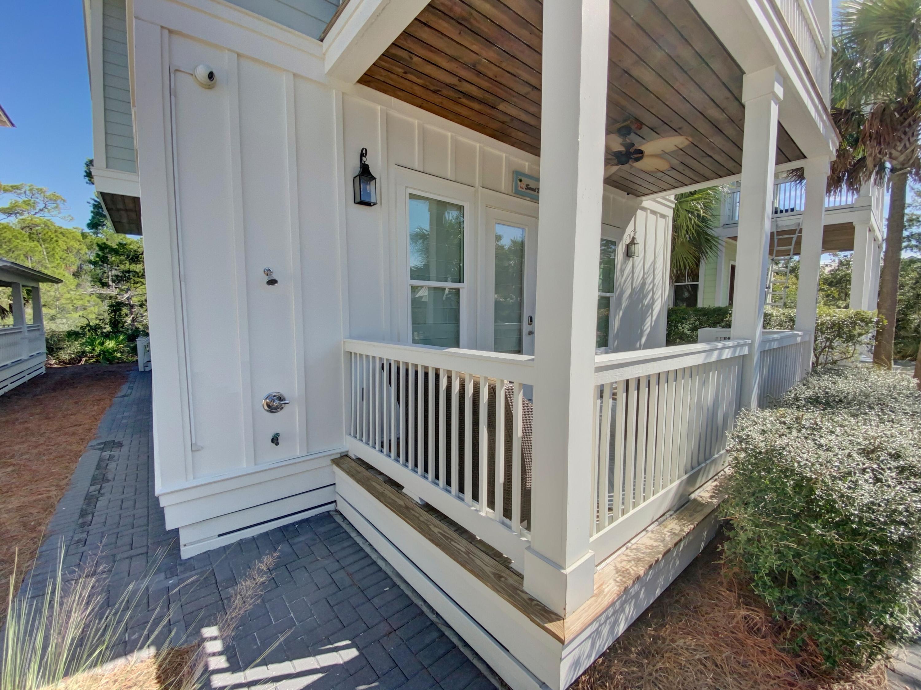 158 East Blue Crab Loop Inlet Beach, FL 32461 - Photo 37 of 43 a view of a porch with wooden floor and fence