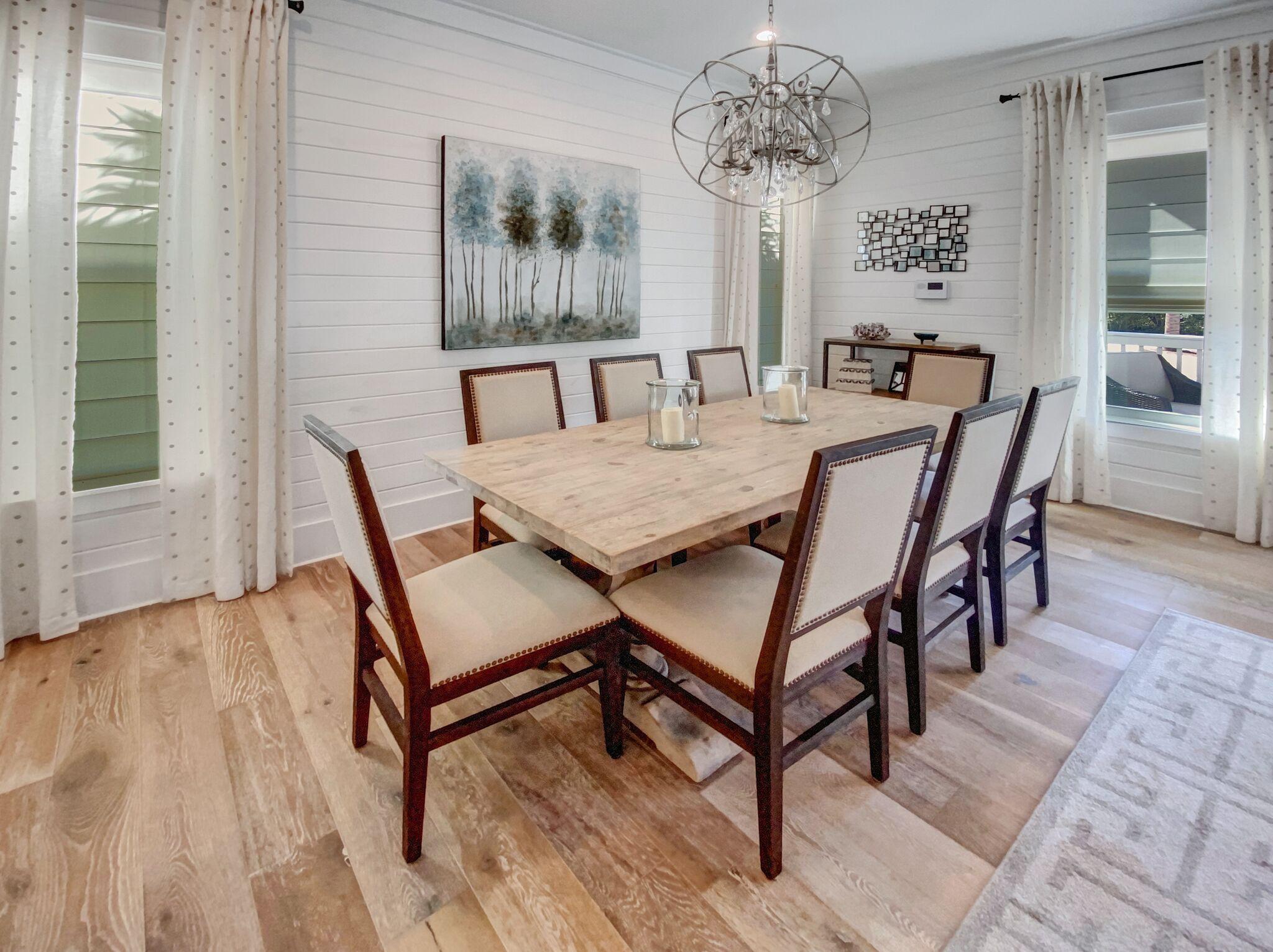158 East Blue Crab Loop Inlet Beach, FL 32461 - Photo 4 of 43 a view of a dining room with furniture and wooden floor