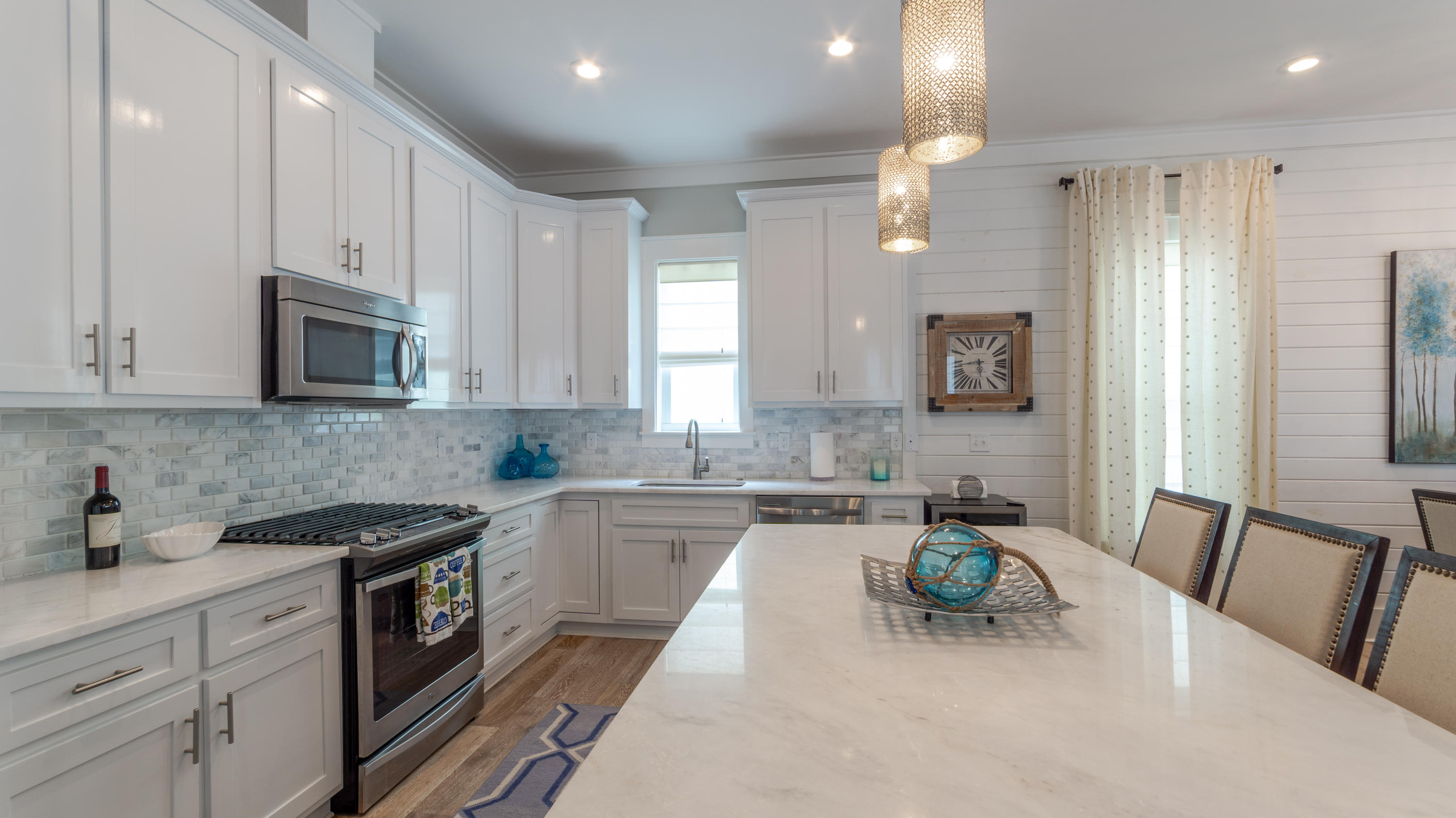 158 East Blue Crab Loop Inlet Beach, FL 32461 - Photo 6 of 43 a kitchen with granite countertop a sink stove and refrigerator