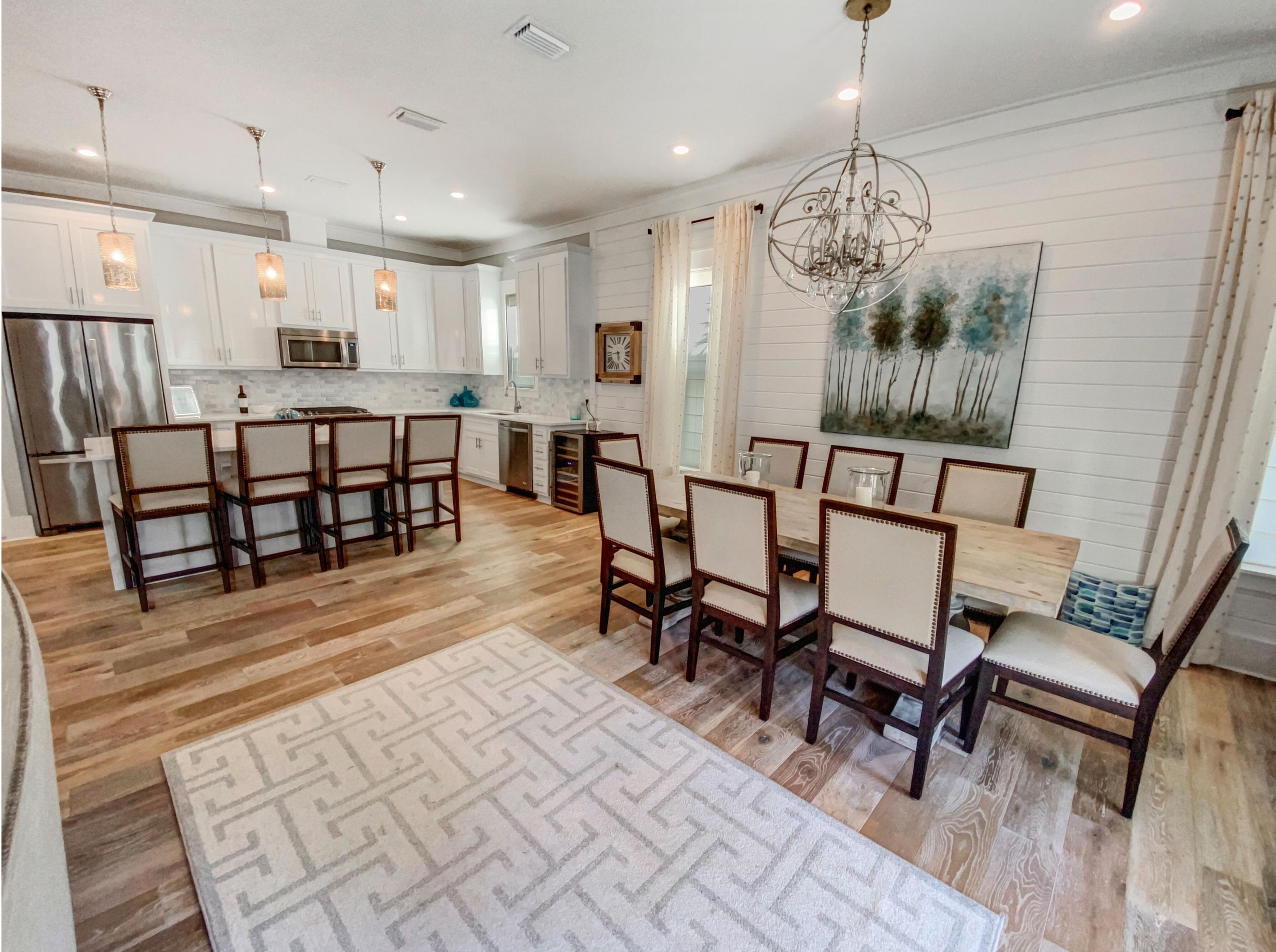 158 East Blue Crab Loop Inlet Beach, FL 32461 - Photo 7 of 43 a view of a dining room with furniture