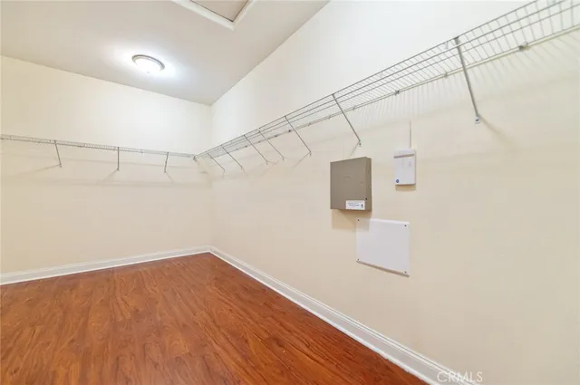 a view of a room with wooden floor