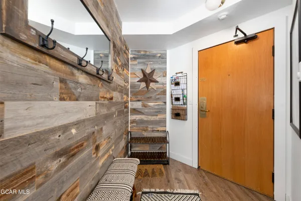 a view of entry way with wooden floor