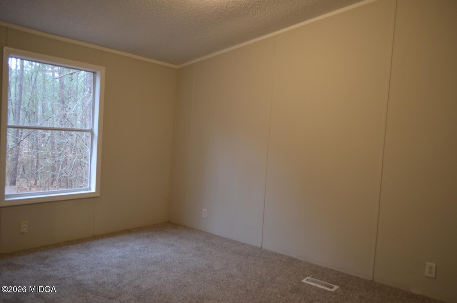 1048 Lee King Road Forsyth, GA 31029 - Photo 14 of 19 a view of an empty room with a window