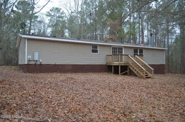 a view of a house with a yard and garage