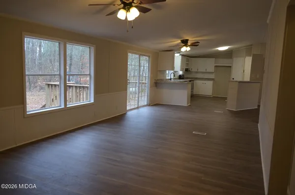 a view of a kitchen with marble kitchen and stainless steel appliances