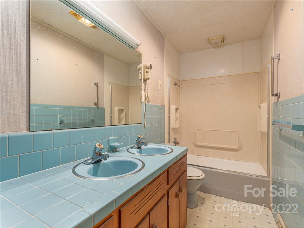 147 Crossroad Hill Road Canton, NC 28716 - Photo 12 of 20 a bathroom with a sink toilet and shower