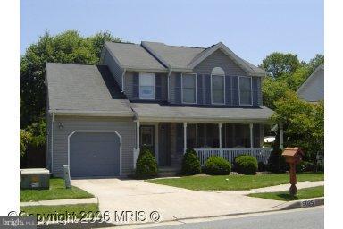 9025 Fieldchat Road Nottingham, MD 21236 - Photo 1 of 11 a front view of a house with a yard and garage